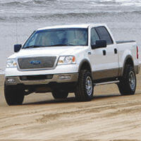 Truck driving on a Frisco NC beach.